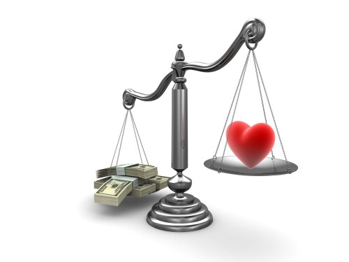 heart and money on the scales